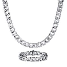 A collection that redefines luxury with its exquisite design. This meticulously crafted set includes a necklace and bracelet, both made from premium grade stainless steel that imparts a sleek, modern aesthetic that complements any ensemble. What sets these pieces apart are the alternating links adorned with ice white Diamondeau®, flawless simulated diamond, adding a touch of opulence and brilliance to the ensemble. Whether you’re dressing up for a special occasion or simply looking to make a sta Modern Stainless Steel Jewelry With Diamond Accents, Diamond White Stainless Steel Jewelry With Diamond Accents, Diamond White Jewelry With Diamond Accents In Stainless Steel, Elegant Stainless Steel Cuban Link Jewelry, Formal Stainless Steel Chain Link Jewelry, Elegant White Stainless Steel Jewelry, Modern Silver Iced Out Jewelry, Modern Stainless Steel Cuban Link Jewelry, White Gold Jewelry With Diamond Accents In Stainless Steel