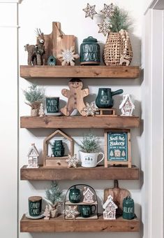 three wooden shelves filled with christmas decorations and other items on top of eachother