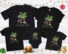 Deck the Palms Beach Christmas family shirts. These coastal Christmas matching tshirts are a great option for matching family tops. Get your family shirts for Mom, Dad, baby, kid, and toddlers. Merry Beachmas! 🎄 Shirt color is black 🎄 100% soft cotton 🎄 Unisex sizing 🎄 See the sizing chart photos for specific measurements CARE INSTRUCTIONS Machine wash: cold; Do not bleach; Tumble dry: low heat; Iron, steam or dry: low heat; Do not dry clean. For baby bodysuit: Non-chlorine: bleach as needed. Beach Tshirts, Deck The Palms, Tropical Tshirt, Hawaii Christmas, Christmas Vacation Shirts, Matching Tshirts, Mom Dad Baby, Beach Tanks Tops, Tropical Holiday