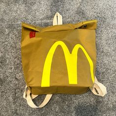 Adjustable Straps Bag Looking Like A Mcdonald Paper Bag Super Cute I’m Lovin Eat Snap Buttons Apple Paper Bag, Adjustable Strap Bag, Paper Bag, Adjustable Straps, Super Cute, Backpacks, Man Shop, Yellow, Quick Saves