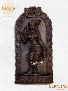 an ornate wooden plaque with the word tacora on it