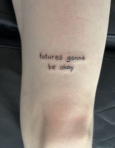 a person with a tattoo on their leg saying futures gona be okay