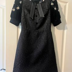 Beautiful Black Brocade Semi Formal Dress In A Classic Style Accented With Velvet, Grosgrain Ribbon Bow, And Jeweled Bees. Measurements Are Shown With Dressmaker Tape. Runs Small. Though It Says Large, I Believe It To Be A Size 2. Feel Free To Ask Me About It. Black Puff Sleeve Dress With Lace Trim, Semi Formal Black Dress, Gold Lace Wedding Dress, Semi Formal Dresses Black, Steampunk Wedding Dress, Ross Dresses, Pronovias Wedding Dress, Disney Wedding Dresses, Amanda Uprichard Dress