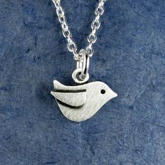 "This sweet little bird is made of sterling silver.  This is one of our TINIEST designs, measuring just under 3/8\" in height (0.9 cm).  Itsy bitsy, and super cute! You can purchase just the pendant, or complete the necklace with a sterling silver chain. © Stick Man Creations This is our own original design, handcrafted by us, and signed on the back with our logo.   For more information about the creative process, click here:  www.etsy.com/shop/StickManJewelry/about CANADIAN ORDERS:  Please note that GST and HST are included in the price, but provincial taxes are not." Cute Silver Sterling Silver Charm Necklaces, Cute Sterling Silver Pendant Charm Necklace, Cute Sterling Silver Pendant Charm Necklaces, Cute Nickel-free Sterling Silver Necklaces, Cute Silver Charm Necklaces, Cute Nickel-free Silver Charm Necklace, Cute Silver Nickel-free Charm Necklaces, Cute Silver Nickel-free Charm Necklace, Small Sterling Silver Charm Necklace