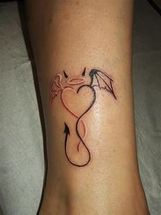 a woman's foot with a dragon tattoo on the side of her leg and an arrow in the shape of a heart