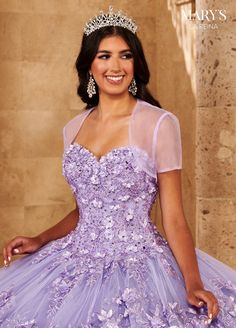 Captivate the room in this 3D floral applique long strapless dress with A-line skirt by Mary's Bridal Quinceanera MQ2145. This strapless glitter tulle quinceanera ball gown features a sweetheart neckline, detachable shoulder straps, lace applique, beading, 3D flowers, lace-up back closure, and a sweep train. Bolero jacket is included. Mary's Bridal La Reina Collection: Spring 2022 Style Number: MQ2145 Fabric: Tulle, Glitter Tulle, Applique, Beading, 3D Flowers Colors: Deep Blush Pink, Lilac Size Fitted Embellished Evening Dress For Quinceanera, Purple Fitted Gown For Quinceanera, Fitted Purple Gown For Quinceanera, Glamorous Fitted Gown For Quinceanera, Fitted Sequin Gown For Quinceanera, Purple Fitted Quinceanera Dress For Formal Occasions, Fitted Purple Quinceanera Dress For Prom Season, Fitted Sequin Dress For Quinceanera, Purple Gown For Debutante Ball In Spring