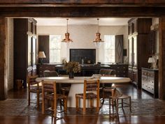 a dining room table and chairs in a kitchen