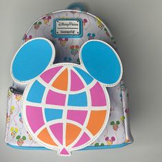 Adorable Disney Mickey Mouse Balloon Loungefly Mini Backpack Disney Parks Epcot. Great Collectible. New With Tags!! - Simulated Leather Mini Backpack - Contrast Trims - Two Side Exterior Slip Pockets - Front Zip Coin Purse Compartment - Loungefly Logo Metal Pulls - Adjustable Padded Shoulder Straps - Top Carry Handle - Disney Parks X Loungefly Logo Label Plate Approx. 10 1/2'' H X 9'' W X 4 1/2'' D Mickey Mouse Balloon, Mickey Mouse Quilt, Mickey Mouse Balloons, Disney Quilt, Mickey Mouse Backpack, Loungefly Mini Backpack, Disney Mouse Ears, Holiday Tote Bag, Walt Disney Mickey Mouse