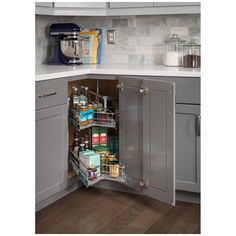 an open cabinet in the corner of a kitchen