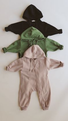 Incredibly soft rib fabric not lined with fleece for the longest wear! True to size with the perfect oversized fit Zips from both ends Neutral smiley is the only fleece lined jumpsuit Casual Long Sleeve Soft Onesie, Long Sleeve Jumpsuits And Rompers For Fall Playtime, Solid Color Long Sleeve Onesie For Playtime, Solid Onesie For Playtime In Fall, Cozy Solid Onesie For Winter, Solid Long Sleeve Onesie For Playwear, Cozy Solid Color Onesie For Winter, Winter Solid Jumpsuits And Rompers For Loungewear, Solid Color Long Sleeve Onesie For Playwear