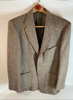 Mens Vintage blazer 44 (HarrisTweedofScotland). Jacket is in really good condition, super clean. From a clean smoke free home. Harris Tweeds from the Outer Hebrides of Scotland give you a wide range of some of the finest tweeds available in the world. Our Harris Tweeds are woven by the islanders at their homes in the Outer Hebrides and made of virgin wool dyed and spun on the islands. Tweed Herringbone Blazer For Business, Tweed Long Sleeve Blazer For Semi-formal Occasions, Long Sleeve Tweed Blazer For Semi-formal Occasions, Semi-formal Long Sleeve Tweed Blazer, Classic Tweed Blazer For Business Casual, Formal Long Sleeve Tweed Sport Coat, Semi-formal Wool Tweed Jacket For Fall, Formal Tweed Sport Coat For Fall, Tailored Tweed Blazer With Houndstooth Pattern