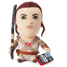 the star wars character doll is next to a cell phone