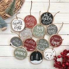 christmas ornament hanging on the wall next to berries and pineconing with sayings