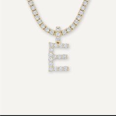 Diamond Letter Necklace (20in) Tennis Chain 3mm Round Cut Stones In Tennis Chain & In “E” Initial. Unisex Yellow Gold Comes With 1 X (3mm Tennis Chain) + 1 “E” Initial. Gemstone: ‘Diamond’ ‘Cubic Zirconia’ Product Width: 3mm Dimensions: 3mm Length: 20in Brand: Gold Presidents Originally $130 Beautiful Item. New In Box Note: Some Of The Pictures Show The Letter “A”. You Won’t Be Getting The Letter “A” In The Pictures. You Will Be Getting The Chain Shown In The Pictures & The Letter “E”. E Initial, The Letter A, Tennis Chain, Letter E, Letter Necklace, Womens Jewelry Necklace, Round Cut, Diamond Jewelry, New Color