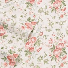 an image of a flowered fabric with pink and green flowers on white background, close up