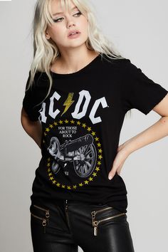 Get ready to rock with AC/DC! "For Those About To Rock" is an iconic AC/DC hit from their 1980 movie, "Live at Donington". This dark and edgy tee features artwork from the album cover in white and yellow. Our relaxed boyfriend tee is made with soft cotton fabric, distressed edges, a raw cut bottom hem, and a loose crew neckline. Details Style #301294 Color: Black AC/DC “For Those About To Rock” Cannon Boyfriend T-Shirt Keyword: ACDC 100% Cotton Care/Import Machine Wash Cold, Tumble Dry Low Desig Rocker Chic Outfits, Ac Dc Rock, Neckline Details, Rocker Chic, Boyfriend T Shirt, Boyfriend Tee, Boyfriend Fit, Ac Dc, Cheetah Print