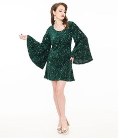 This flirtatious 1960s inspired piece is crafted in green stretch knit fabric that dances with dazzling green sequins throughout. The wide scoop neckline is framed by jaw-dropping long angel sleeves. Complete with a back zipper and side pockets!.Available in sizes XS-4X while supplies last. | Smak Parlour 1960S Green Sequin Downtown Scene Mini Dress | Size Xsmall/2 1960s Inspired, Angel Sleeves, Outfit Wedding Guest, Angel Sleeve, Green Sequins, Comfortable Dress, Fashion Help, Nordstrom Dresses, Large Size Dresses