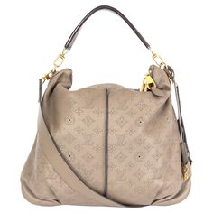 100% authentic Louis Vuitton Mahina Selene MM Bag in Monogram taupe Mahina calfskin featuring a espresso brown top handle. Opens with a double-zip on top and is lined in back microfibre with one zipper pocket against the back and two open pockets against the front. Comes with a detachable shoulder strap, lock, key, clochette and dust bag. Has been carried with some very faint wear to the corners. Overall in excellent condition. Measurements Height 36cm (14in) Width 46cm (17.9in) Depth 5cm (2in) Mens Leather Laptop Bag, Rattan Bag, Espresso Brown, Leather Laptop Bag, Vintage Purses, Brown Top, Knitted Bags, Hand Bags, Designer Bags