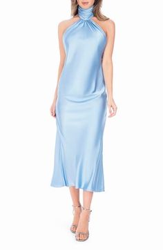 The dreamy drape of satin gives the sense of fluid movement to this cocktail dress featuring a jaw-dropping open-back silhouette and a shirred halter neckline. 54" center front length (size Medium) Hidden side-zip closure Halter neck Sleeveless Lined 100% polyester Dry clean Made in the USA of imported fabric Spring Satin Midi Dress With Ruched Back, Elegant Silk Slip Dress With Ruched Back, Spring Satin Midi Dress With Cowl Back, Elegant Blue Halter Neck Slip Dress, Spring Evening Ruched Back Slip Dress, Blue Satin Halter Neck Slip Dress, Spring Evening Slip Dress With Ruched Back, Elegant Satin Dress With Ruched Back For Spring, Summer Evening Satin Dress With Ruched Back