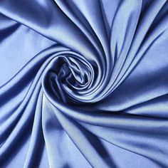 an image of a blue fabric that is very close to the camera and looks like it has