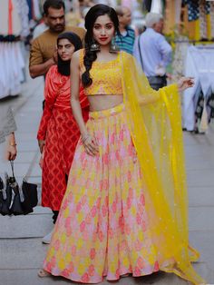 This exquisite ensemble features a yellow color organza lehenga adorned with digital print work, sequins, and thread embroidery work, creating a contemporary and elegant look. The similar color slub silk choli is embellished with sequins, thread embroidery work, and mirror work, adding a touch of glamour to the outfit. Completing the look is a similar color organza dupatta with sequins and thread embroidered work, along with a designer lace borderwork for a stylish finish.
The semi-stitched lehe Unstitched Multicolor Organza Lehenga, Yellow Tissue Silk Anarkali Set For Diwali, Yellow Choli With Sheer Dupatta For Navratri, Yellow Organza Lehenga With Resham Embroidery, Festive Organza Palazzo Set With Cutdana Details, Festive Organza Palazzo Set With Cutdana, Yellow Silk Lehenga For Eid, Yellow Silk Sharara For Party, Yellow Silk Choli For Eid