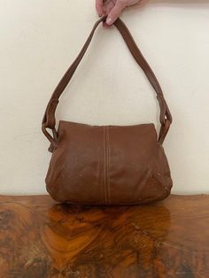 "Vintage Brown Leather purse, shoulder bag, 1970s, slightly distressed, Boho purse, Whiskey brown, Hippie purse Nice solid all leather 1970s brown leather purse Good condition, sound construction some light marks on the back. No damage Flap over closure 3 seperate sections. 1 zippered 1 center 1 large main section Measurements: 9\" x 13\" x 3\" Strap drop: 15\" NK528DR Vintage Brown Leather purse, shoulder bag, 1970s, slightly distressed, Boho purse, Whiskey brown, Hippie purse" Vintage Everyday Hobo Bag Shaped As Satchel, Vintage Satchel Hobo Bag, Vintage Hobo Satchel Bag For Everyday, Retro Brown Satchel With Removable Pouch, Vintage Everyday Hobo Bag, Vintage Satchel Hobo Bag For Everyday, Vintage Brown Bag For Everyday Use, Vintage Brown Hobo Bag For Everyday, Retro Brown Satchel Shoulder Bag