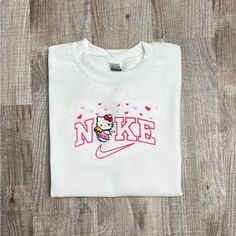 This Crewneck Is Embroidered And Comes In All Sizes And Colors. Unisex Sizing. Hello Kitty Print Crew Neck Cotton Sweatshirt, Cotton Crew Neck Sweatshirt With Hello Kitty Print, Cute Crew Neck Tops With Custom Embroidery, Cute White Embroidered Sweatshirt, Cute White Top With Embroidered Logo, Cute White Tops With Embroidered Logo, Cute White Tops With Letter Embroidery, Cute White T-shirt With Embroidered Logo, Hello Kitty Nike