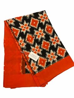 Double Ikkat Telia Rumal Handwoven Designer Cotton Saree in Black/Orange (with Blouse) Traditional Fitted Ikat Print Saree, Orange Block Print Dupatta, Fitted Orange Cotton Traditional Wear, Orange Handloom Cotton Silk Saree, Handloom Cotton Saree In Orange, Orange Cotton Handloom Saree, Orange Handloom Dupatta, Orange Chanderi Handloom Blouse Piece, Orange Block Print Dupatta For Festivals