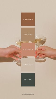 two hands holding wine glasses with different colors