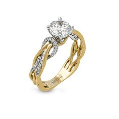 a yellow and white gold engagement ring with diamonds