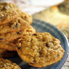 a blue plate topped with cookies on top of a table