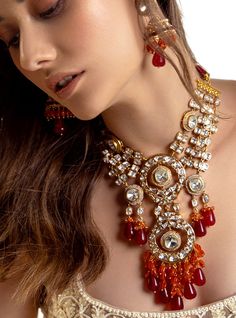 Multi Coloured Polki Bridal Necklace Set - Joules By Radhika Radiate romance with our 22Kt Gold Plated necklace set, a perfect match for brides on their wedding day. The enchanting Hydro Polkis, complemented by alluring red Agate drops and vibrant carnelian beads, create a captivating ensemble. Embrace the elegance and charm of this exquisite set, adding a touch of sophistication to your bridal allure. SET INCLUDES: Necklace and Earrings Details: Handcrafted with ❤️ Metal: Brass Product Type: Ne 22k Gold Cutdana Bridal Earrings, Gold Fusion Style Bridal Necklace With Cutdana, 22k Gold Meenakari Bridal Necklace For Wedding, 22k Gold Cutdana Bridal Earrings For Wedding, Exquisite Kundan Jewelry For Reception, Fusion Style 22k Gold Necklace For Wedding, 22k Gold Fusion Necklace For Wedding, Yellow Gold Bridal Earrings With 17 Jewels For Wedding, 22k Gold Fusion Style Wedding Necklace