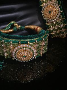 Green Velvet Pounchi ,Adorable Bracelet/ gold Bead Beaded, Resham Thread Handmade Ceremonial Jewelry For Festivals, Adjustable Kundan Necklace With Tilla For Festivals, Adjustable Traditional Kundan Necklace With Stone Work, Traditional Adjustable Kundan Necklace With Stone Work, Bohemian Bracelets For Diwali Ceremonial, Festive Gota Work Jewelry For Diwali, Adjustable Traditional Bracelets With Gota Work, Traditional Adjustable Bracelets With Gota Work, Bohemian Adjustable Bangle For Diwali