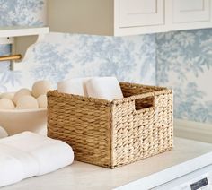 a wicker basket sitting on top of a kitchen counter