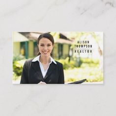 a business card with an image of a woman in a black suit and white shirt