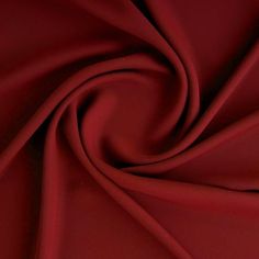 a close up view of a red fabric