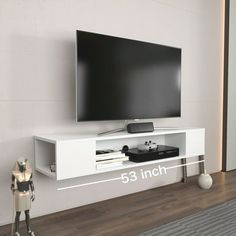 an entertainment center with a large flat screen tv mounted on it's side wall