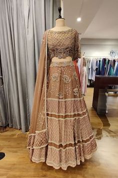 Copper attached cancan lehenga featuring sequin, glass bead hand embroidery in paisley and geometric pattern. Paired with an embroidered, padded blouse and a dupatta. - Aza Fashions Traditional Draped Hand Embellished Lehenga For Navratri, Hand Embellished Lehenga For Navratri With Traditional Drape, Hand Embellished Lehenga For Navratri, Transitional Hand Embellished Lehenga, Hand Embellished Fitted Sets With Traditional Drape, Designer Georgette Lehenga Hand Embellished, Hand Embellished Georgette Lehenga For Designer Wear, Fitted Hand Embellished Dupatta For Navratri, Hand Embellished Fitted Dupatta For Navratri