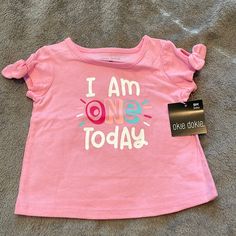 “I Am One Today” Pink Girls Short Sleeve Shirt. Cute Little Tie Sleeves! Fun Cotton Tops For First Birthday, Cotton Tops For First Birthday, Pink Cotton Tops For First Birthday, Casual Pink Top For First Birthday, Casual Pink Tops For First Birthday, Peanuts T Shirts, Happy Tees, Okie Dokie, Dinosaur Shirt