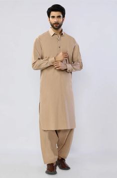 Mens Beige Plain Shalwar Kameez Mens Eid Shalwar Kameez Color: Beige Fabric: Cotton Dress Type: Handmade Please beware when you're choosing the variations of this dress. Feel free to discuss any issue regarding your order. You'll get a quick solution and will be satisfied. Formal Cotton Sherwani With Dabka Work, Cotton Traditional Wear For Semi-formal Occasions, Semi-formal Cotton Traditional Wear With Long Sleeves, Classic Dabka Sherwani For Eid, Cotton Traditional Long Sleeve Semi-formal Wear, Semi-formal Long Sleeve Cotton Traditional Wear, Classic Kurta With Naqshi For Festive Occasions, Traditional Cambric Kurta With Naqshi Detailing, Traditional Cambric Kurta With Naqshi