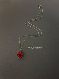 Dark red rose necklace. Red rose is on a delicate but sturdy 18'' stainless steel chain with lobster clasp. If you choose to add initials, please leave the initials in order left to right in the note to sellers box during checkout. *Necklace is available with 1,2 and 3 leaves *15mm Resin rose *Silver plated brass leaves *Stainless steel chain *Handmade with love <3 Like Jmesjewelrybox on Facebook for updates on new jewelry, upcoming sales and giveaways! Plus Facebook fans save 5% :D Find the Dainty Rose Jewelry For Valentine's Day, Rose Nickel Free Jewelry For Gift, Rose-colored Nickel-free Jewelry For Gifts, Rose Nickel-free Jewelry For Gift, Rose Red Roses Jewelry For Valentine's Day, Red Dainty Jewelry For Mother's Day, Rose Red Jewelry With Rose Design For Gift, Rose Sterling Silver Jewelry For Valentine's Day, Dainty Red Flower Necklace