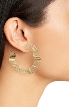 Gleaming waves undulate along the curves of these golden hoop earrings in an oversized silhouette that catches the light with every turn of your head. Recycled metal/goldtone plate Imported Recycled Claim Standard (RCS) is a standard for tracking and verifying the presence of recycled raw materials through the supply chain to final product Golden Hoop Earrings, Gothic Floral, Golden Hoops, Earrings In Gold, Recycled Metal, Oversized Silhouette, Supply Chain, Your Head, Gold Tones