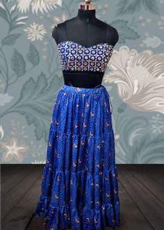 Blue bandhani print lehenga with faux mirror work bralette blouse and georgette dupatta Lehenga skirt Base fabric: Satin georgette  Details: bandani print Flare:7m , tiered design Lining: satin and cotton Blouse: faux mirrors dyed to match the lehenga in bralette style Lining: cotton Dupatta: blue georgette dupatta Size: Please choose a standard size from the drop-down or your can choose custom measurements. The dress will be made to order in the size you choose or for custom measurements, I'll Fitted Bohemian Bandhani Print Lehenga, Fitted Bohemian Lehenga With Bandhani Print, Bohemian Fitted Lehenga With Bandhani Print, Fitted Bohemian Bandhani Print Sharara, Fitted Bohemian Anarkali Set With Bandhani Print, Bohemian Fitted Bandhani Print Sharara, Bohemian Fitted Anarkali Set With Bandhani Print, Bohemian Fitted Sharara With Bandhani Print, Bohemian Bandhani Print Fitted Choli