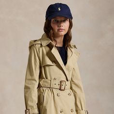 A smart layer for transitional climes this cotton trench coat features a water-resistant shell and a removable hood. Rain Slicker, Cotton Trench Coat, Polo Hat, Hooded Trench Coat, Girls Outerwear, Ralph Lauren Purple Label, Rain Coat, Trench Coats Women, Girls Jacket