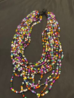 African Maasai beaded necklace for women. Handcrafted and produced by local communities in Tanzania, Africa. Theses pieces of Jewelery are carefully selected from local Vendors based in Tanzania, Africa. Karibu sana! Artisan Multi-strand Jewelry With Tiny Beads, Unique Long Beaded Necklace With Faceted Beads, Traditional Multicolor Necklace With Faceted Beads, Festival Long Beaded Necklaces, Long Beaded Necklace For Festivals, Adjustable Colorful Beaded Necklace For Festivals, Artisan Multi-strand Necklace With Faceted Beads, Artisan Beaded Necklaces For Festivals, Traditional Multi-strand Beaded Necklaces