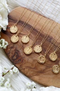 The Zodiac Coin Gold Necklace is the sweetest symbol of the energy of the cosmos. When the Sun, Moon, and planets are in a constellation of stars they channel and reflect energies of the zodiac creating our Sun, Moon and Rising signs. Adorn the spirit in your or a loved ones sign with a high quality 14k Gold Plated Zodiac Coin with Cubic Zirconias set on a delicate 14k Goldfilled dainty Chain. Aries ~ March 21st - April 19thEnthusiastic, Confident, Passionate, Optimistic Taurus ~ April 20th - May 20thPatient, Grounded, Beauty, Reliable Gemini ~ May 21st - June 20thCurious, Gentle, Affectionate, Expressive Cancer ~ June 21st - July 22ndLoyal, Emotional, Compassionate, Creative Leo ~ July 23rd - August 22ndCreative, Passionate, Bold, Dramatic Virgo ~ August 23rd - September 22nd Loyal, Analy Celestial Zodiac Sign Pendant Necklaces, Celestial Zodiac Sign Pendant Necklace, Celestial Zodiac Pendant Necklace, Spiritual Zodiac Sign Pendant Necklace, Zodiac Sign Amulet Necklace With Round Pendant, Spiritual Zodiac Sign Charm Necklace Gift, Celestial Necklaces With Coin Pendant As Gift, Celestial Necklace With Coin Pendant As Gift, Constellation Of Stars