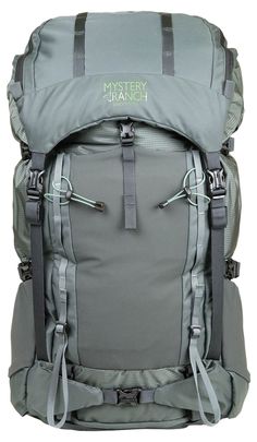 a grey backpack with the name mystery ranch on it's back pocket and straps