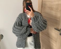 "Grey hand knit Chunky wool Cardigan  PRE- ORDER Yarn: ✔️60% acrylic  ✔️40% wool ONE SIZE Dimensions: Length - 73 cm. /28.7\" Width - 56 cm. /22\" Sleeve lenght - 72 cm. /28\" Sleeve girth -42 cm. /16.5\" This is an oversize bulky cardigan from the  half- wool yarn. Wide sleeves. Hand knit and long oversized cardigan. Care Recommend profession clean Or Hand delicate wash 30Co/86Fo Don't hang Don't bleach" Gray Knitted Acrylic Outerwear, Cozy Gray Chunky Knit Cardigan, Oversized Gray Chunky Knit Cardigan, Gray Chunky Knit Outerwear, Gray Chunky Knit Sweater Coat For Fall, Cozy Gray Chunky Knit Pattern, Wool Chunky Knit Winter Cardigan, Cozy Gray Knitted Cardigan, Gray Knitted Sweater Coat