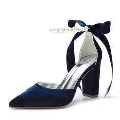 a pair of blue high heel shoes with a bow on the ankle and pearl accent