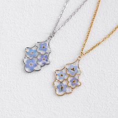 Forget Me Not Flower Necklace for Women | Handmade Real Flower Necklace | Resin Jewelry | Birthday Gift for Mom | Gift for Her 🌿The Forget Me Not Flower Necklace for Women is a stunning and meaningful piece of handmade jewelry. This necklace features real Forget Me Not flowers encased in high-quality resin, capturing the delicate beauty of nature. It makes a perfect birthday gift, anniversary gift, or a thoughtful present for any special woman in your life. 🌿Highlights: Real Forget Me Not Flowers: This necklace features genuine Forget Me Not flowers, symbolizing true love and remembrance, making it a sentimental and meaningful piece. Handmade Jewelry: Each necklace is carefully handmade, ensuring attention to detail and creating a truly special piece. Resin Jewelry: The high-quality resi Birthday Jewelry With Pressed Flowers, Birthday Flower Jewelry With Pressed Flowers, Birthday Flower-shaped Jewelry With Pressed Flowers, Flower Necklace With Pressed Flowers For Birthday, Mother's Day Pressed Flower Necklace, Silver Flower Charm Necklace For Birthday, Delicate Flower Necklace For Birthday, Flower Shaped Necklace For Birthday Gift, Gift Flower Necklace With Pressed Flowers